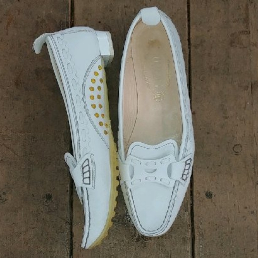 Tod's luxury white loafers.
